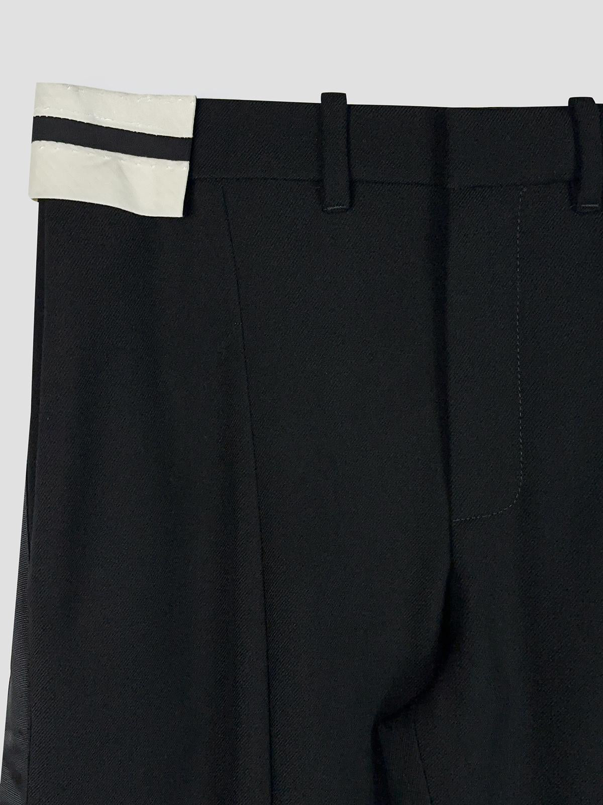 Exposed waistband tailoring trouser
