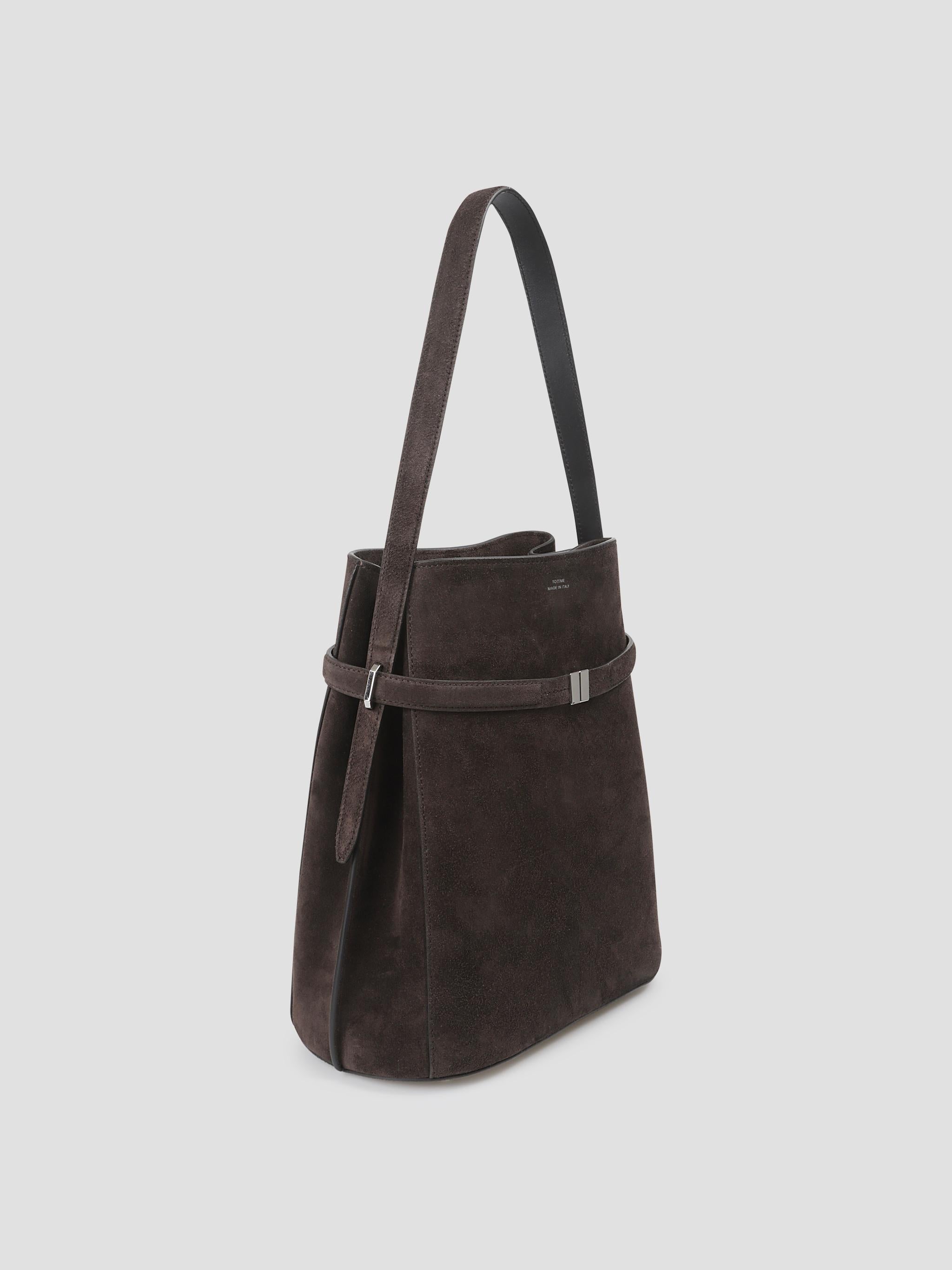 Belted suede bucket bag