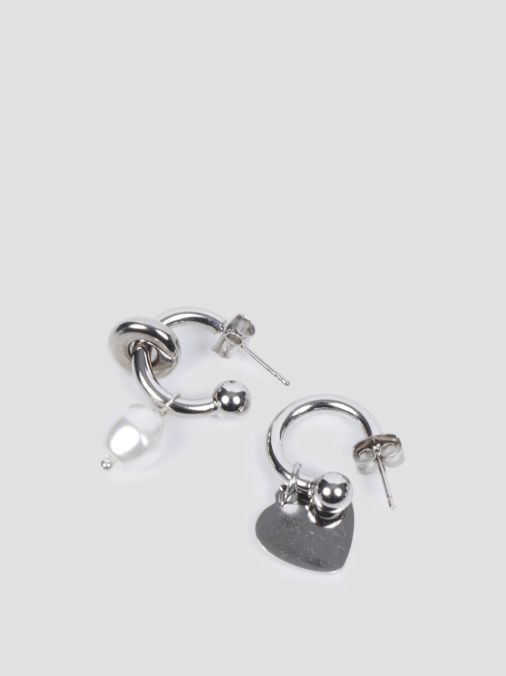 Jacob mismatched earrings