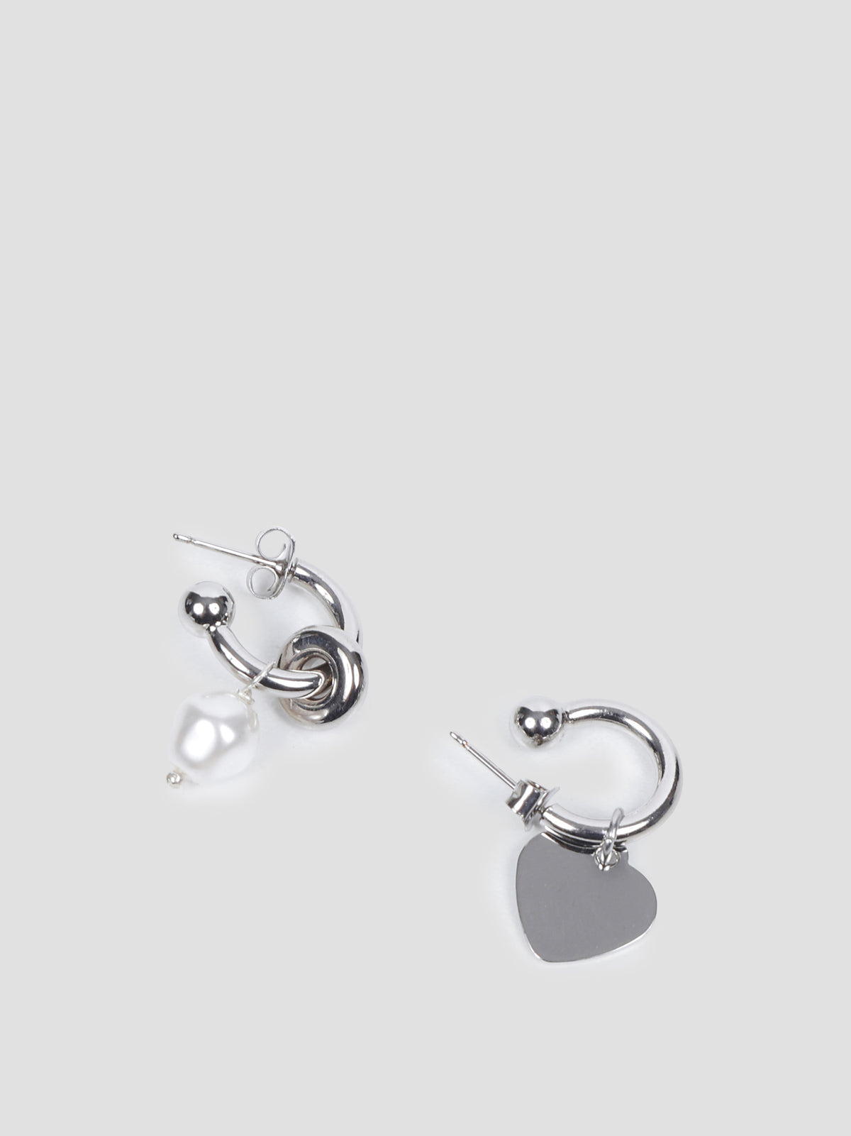 Jacob mismatched earrings