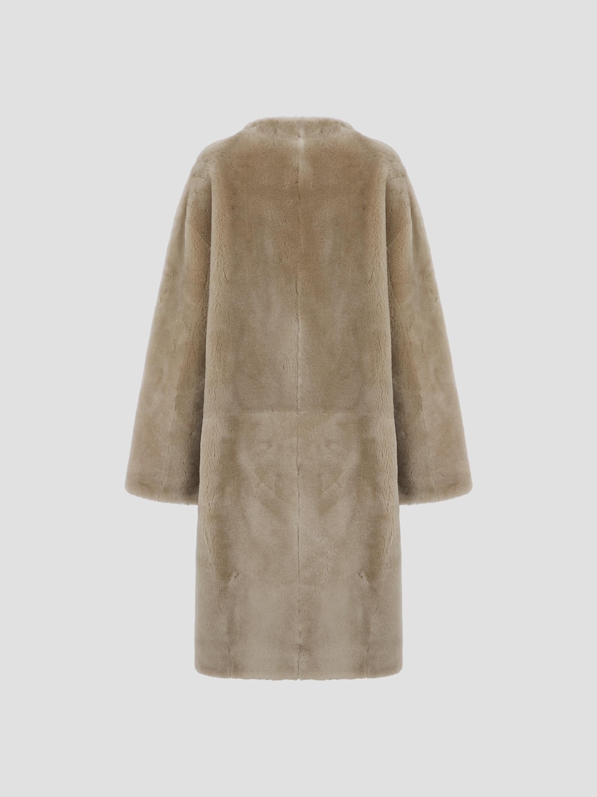 Collarless shearling coat